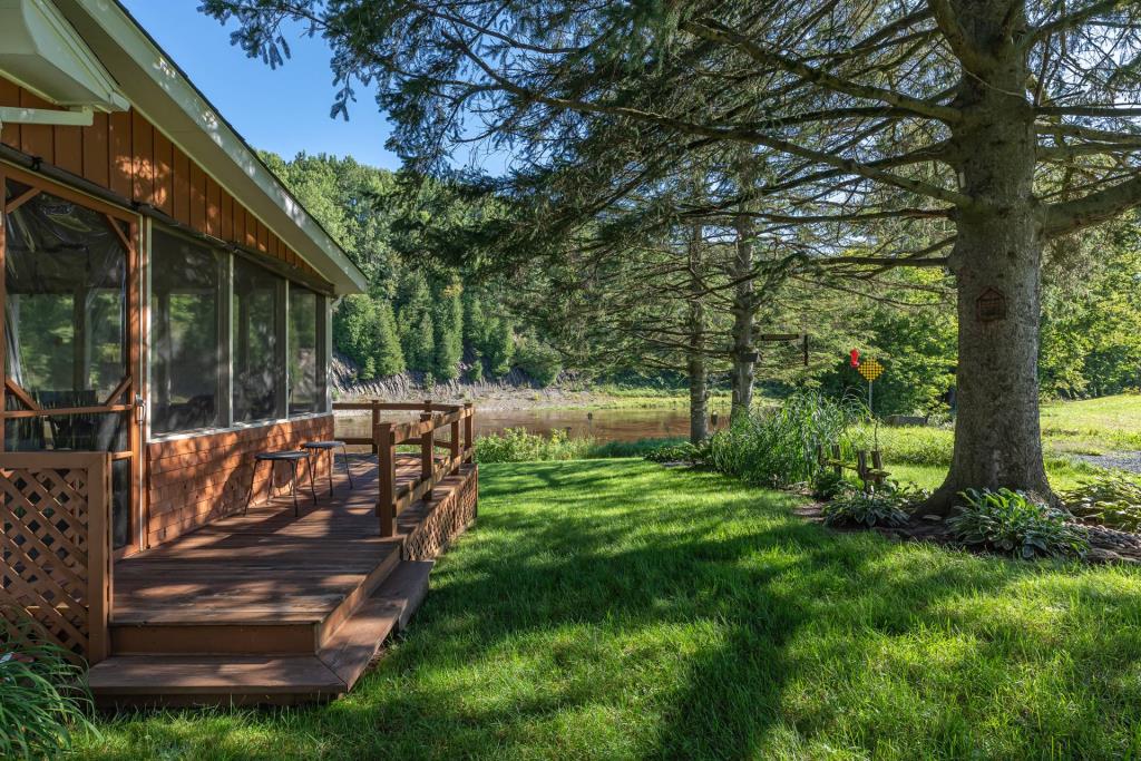 Warm weather awaits at this small $149,000 riverside retreat