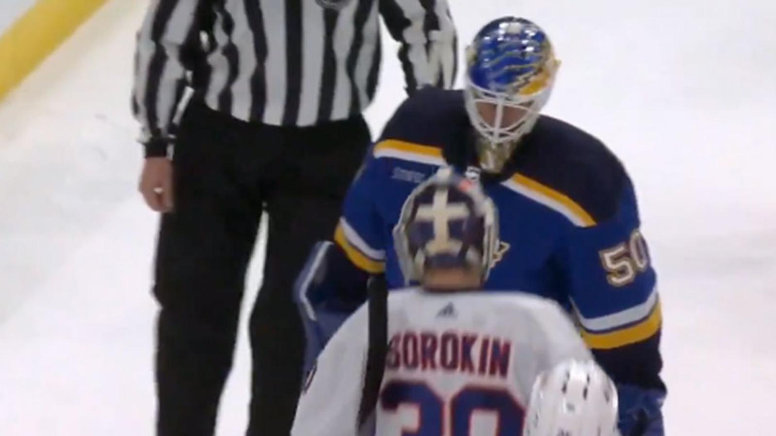 Jordan Binnington hits Ilya Sorokin with a legit body check as they head off the ice