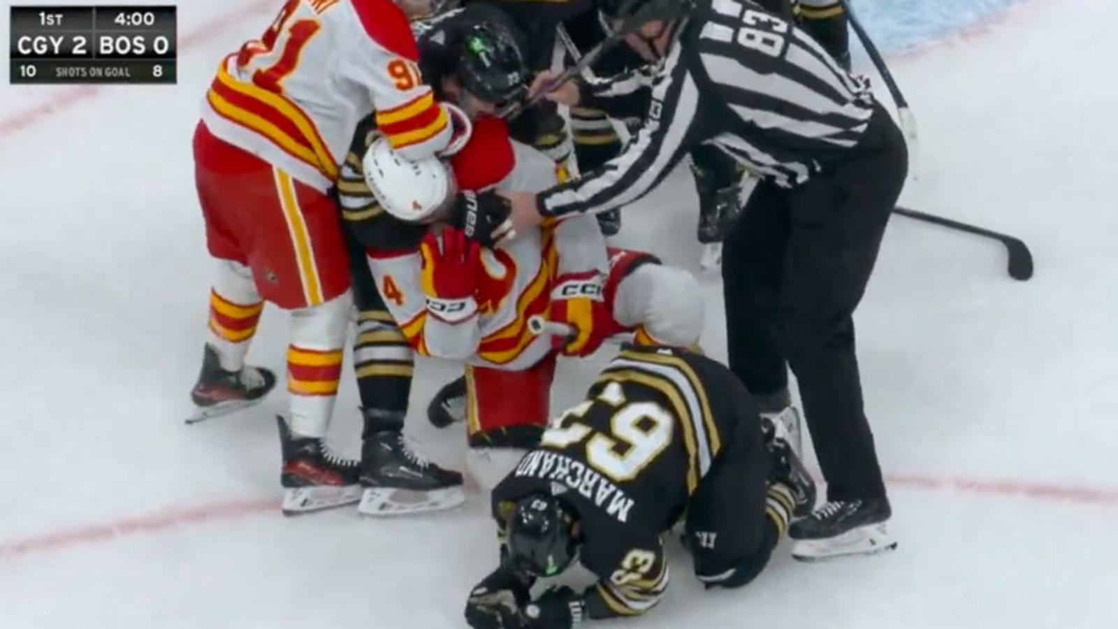 Brad Marchand gets destroyed by 4 Flames players