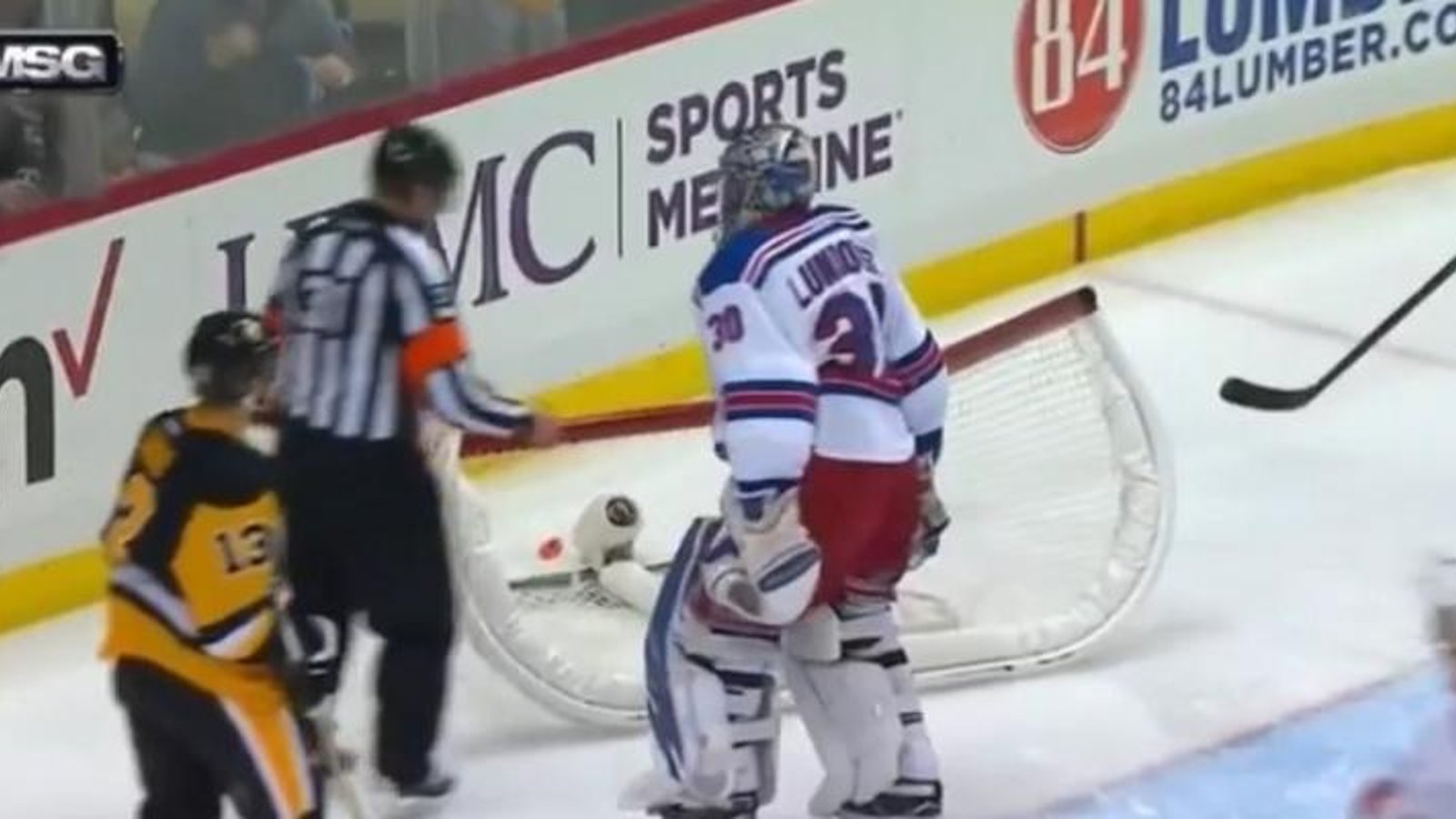 Lundqvist loses it, knocks over his own net during play.