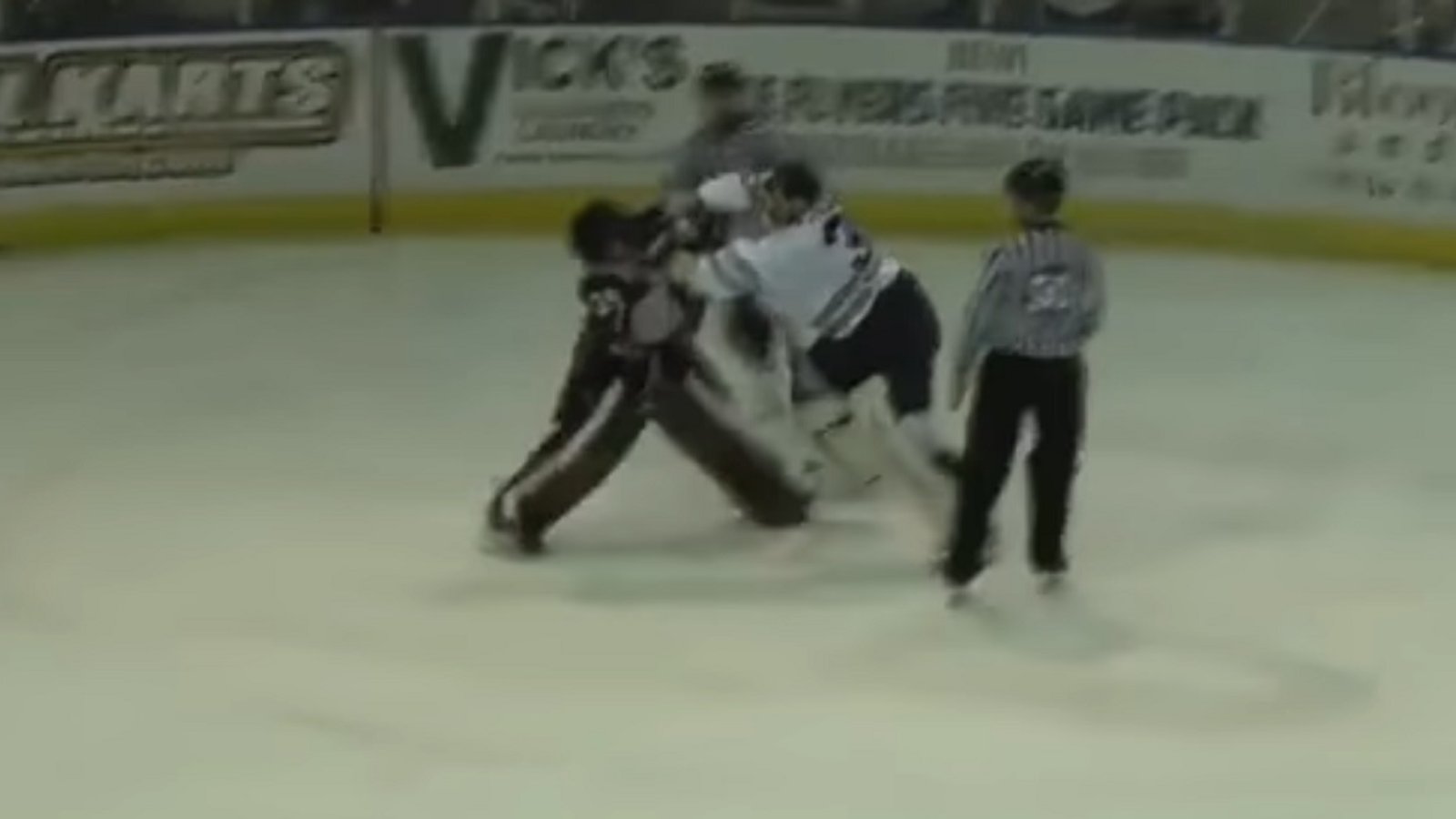 Two goalies throw down after a stoppage in play.