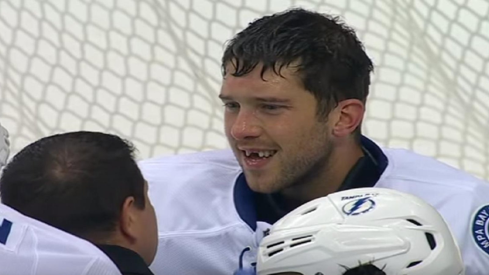Goalie loses two front teeth after making save
