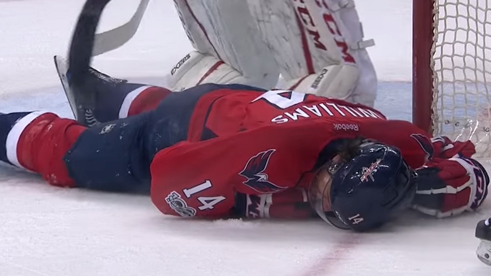 OUCH! Williams goes down after eating a one-timer in the head.