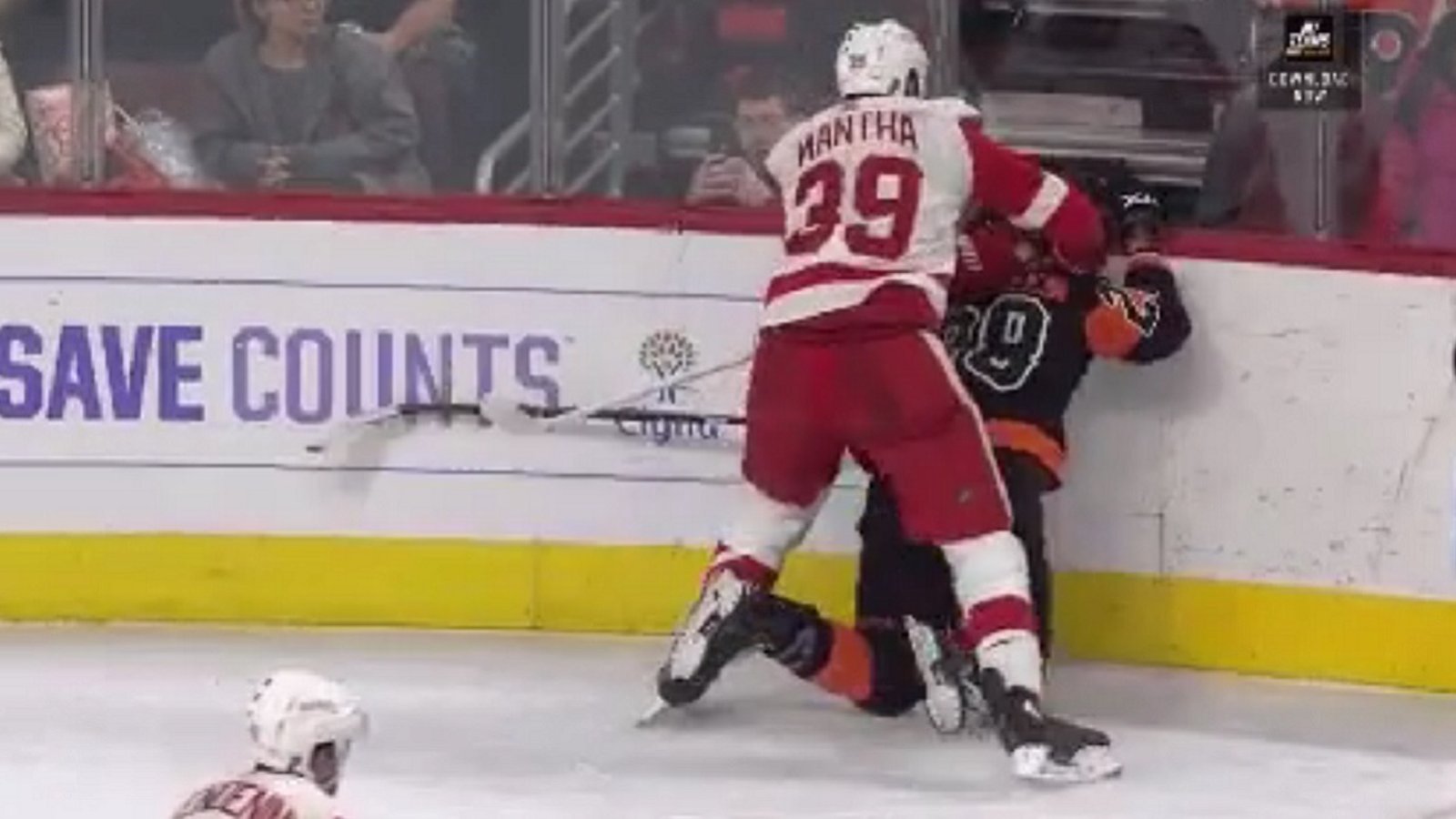 Mantha drills Giroux's head into the boards during Saturday's match up.