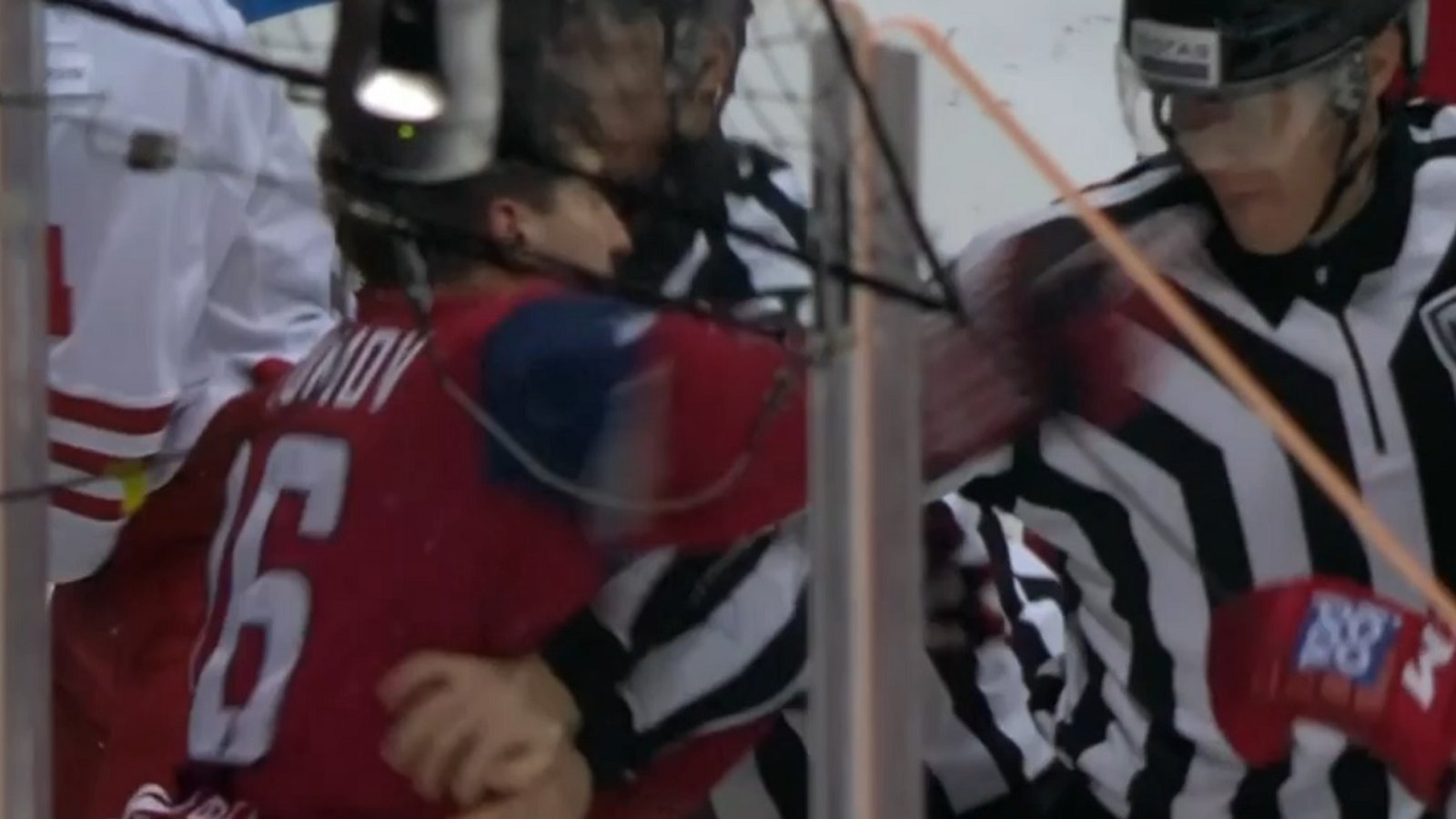 NHL prospect punches referee in the face after a nasty hit to the head.