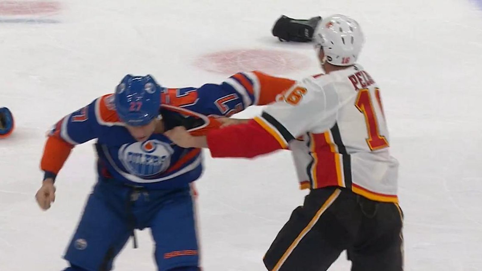 Anthony Peluso takes on Milan Lucic in the Battle of Alberta.
