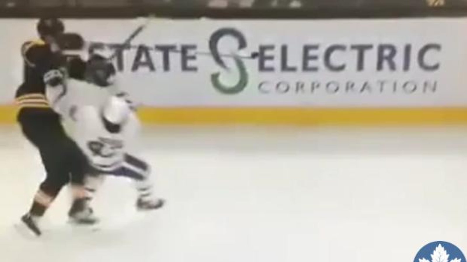 Leafs rookie Moore sends giant Chara flying into boards with demolishing hit! 