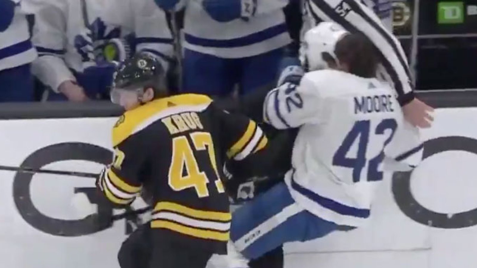 Krug takes out Moore and a referee at the same time! 