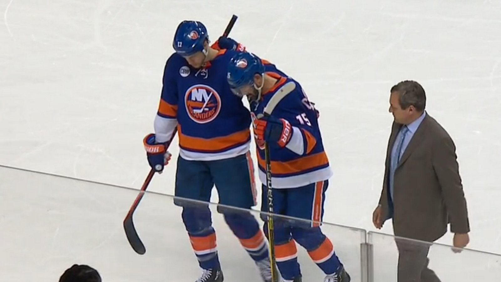 Report: Cal Clutterbuck carried off the ice after the end of Game 2.