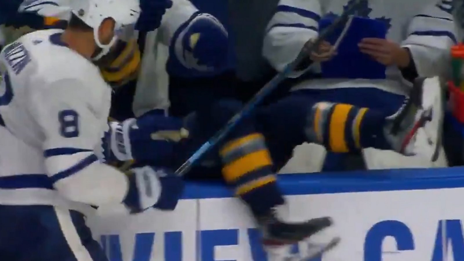Muzzin dumps Olofsson into the Maple Leafs bench.