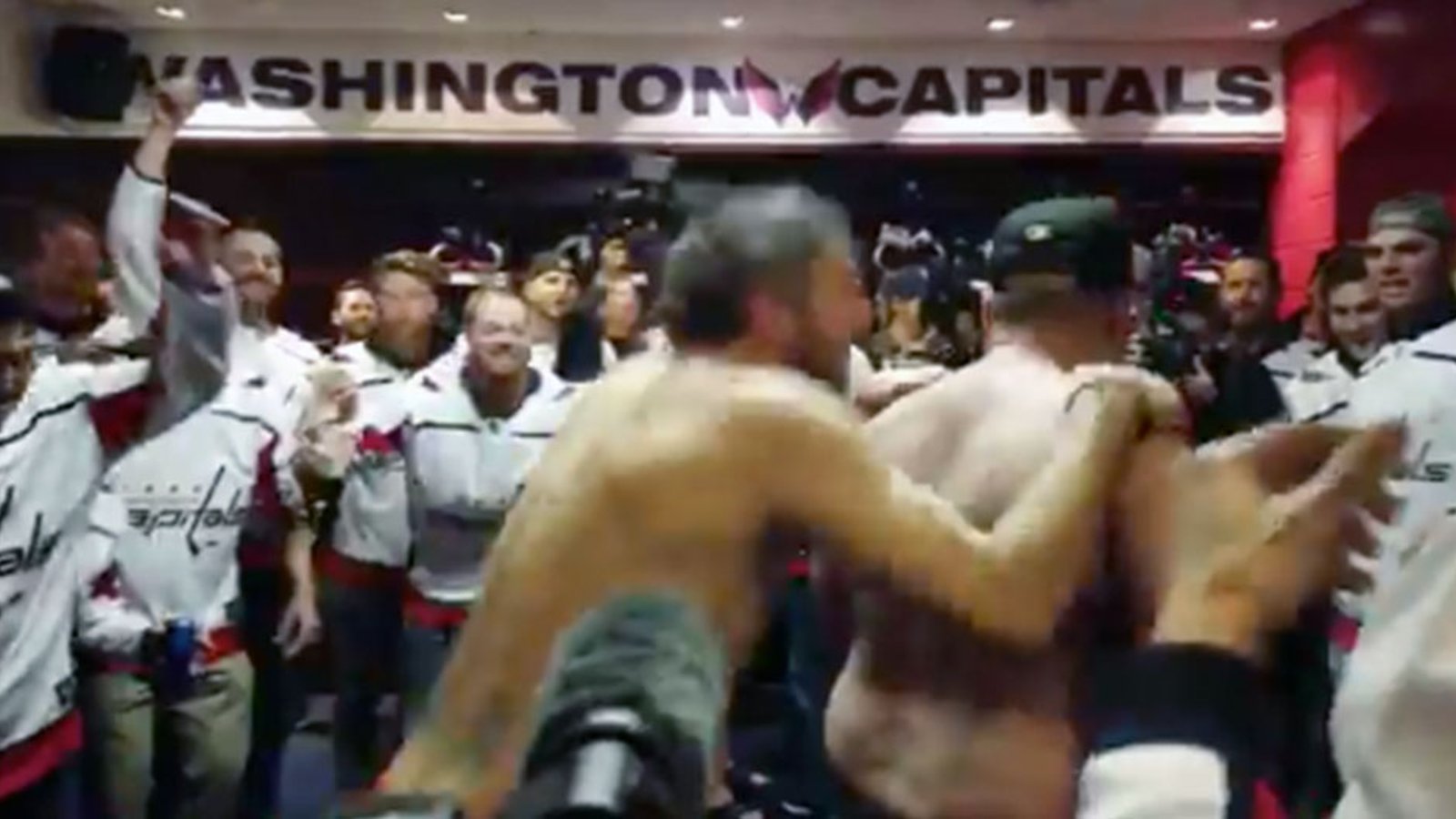Ovi pops off his shirt then goes for a piggy back ride around the Caps locker room