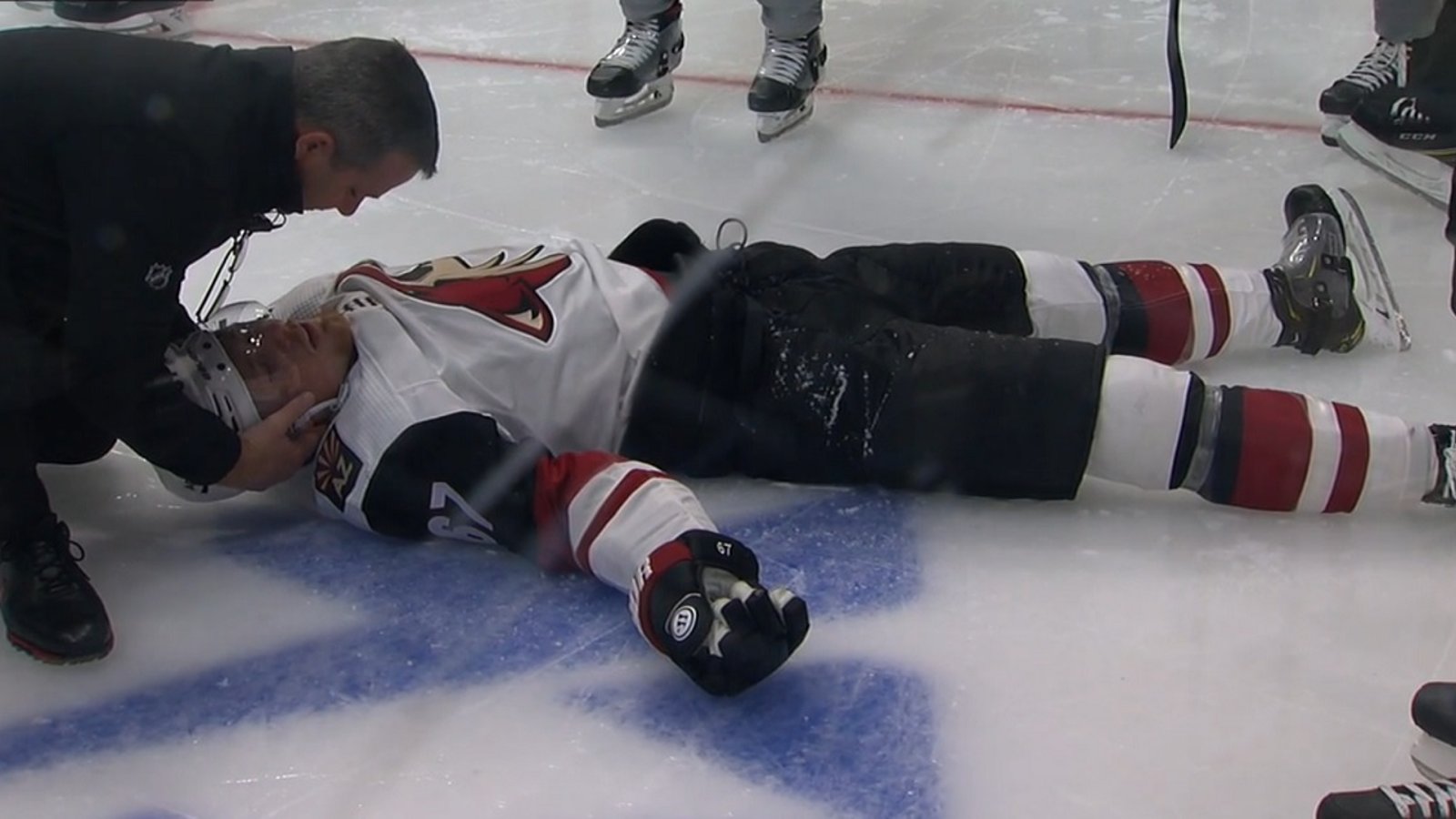 Lawson Crouse in bad shape after going head first into the boards.