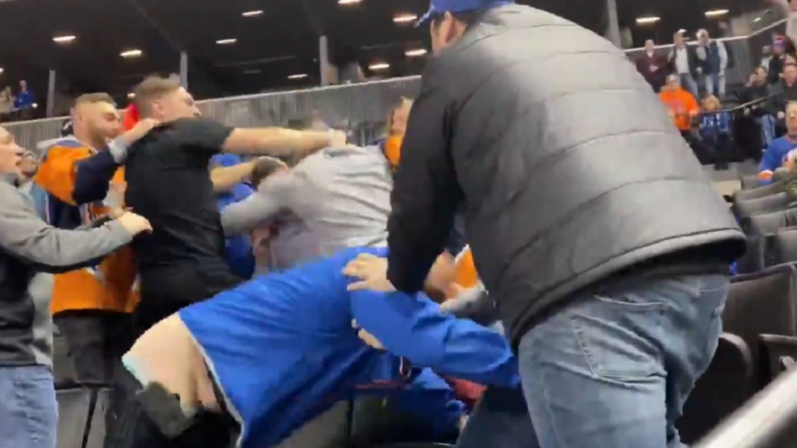 Brawl breaks out in the crowd at NHL game.