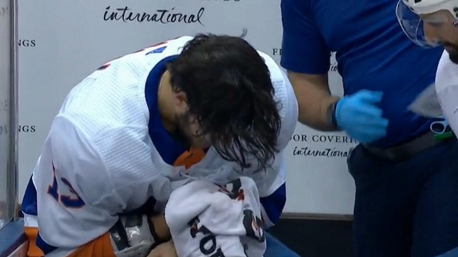 Eberle accidently gives Barzal a serious hack to the face.