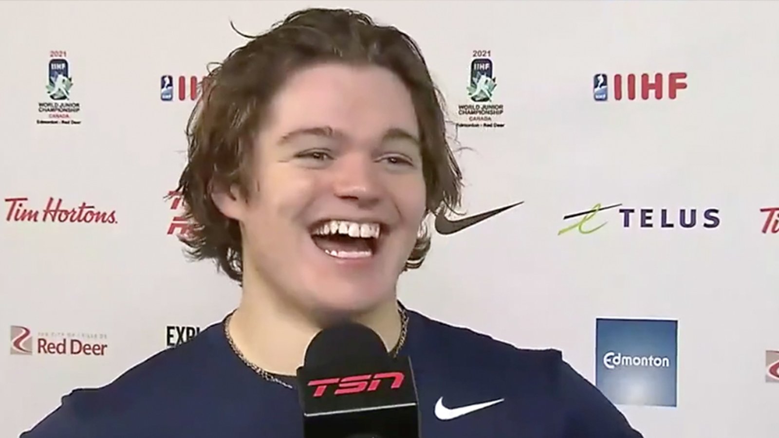 Cole Caufield swears on live TV then can't help from bursting out into laughter