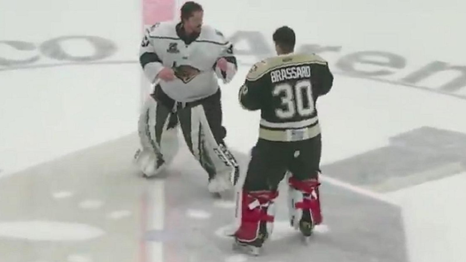 Goalie fight breaks out at center ice after a crazy brawl in the ECHL!