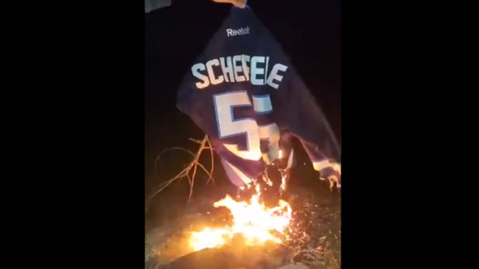 Fan burns his Mark Scheifele jersey after last night's devastating hit on Jake Evans